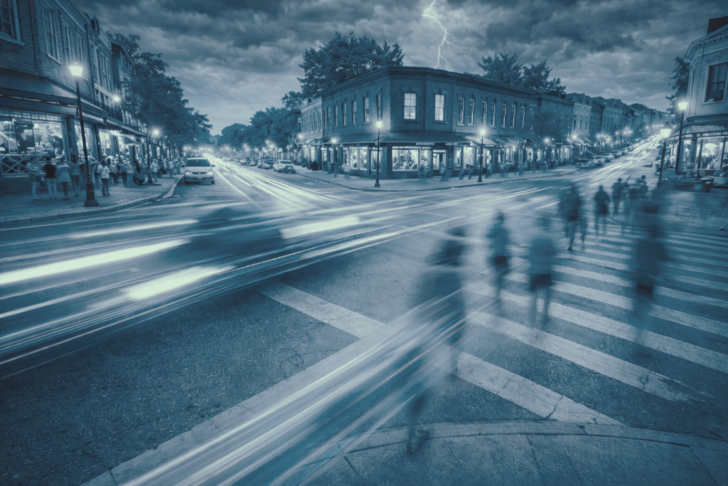 Busy intersection showing movement of vehicles, pedestrians and weather
