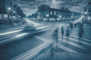 Busy intersection showing movement of vehicles, pedestrians and weather